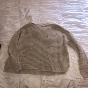 “Ripped sweater”